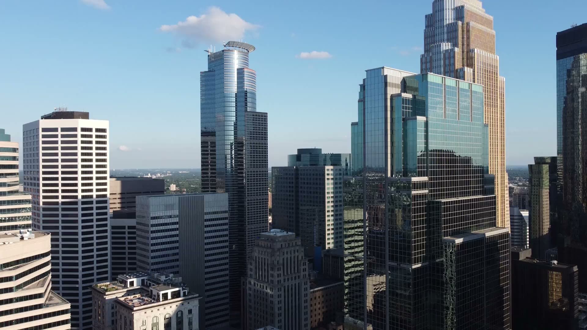Downtown skyline of glass office towers seen from above.