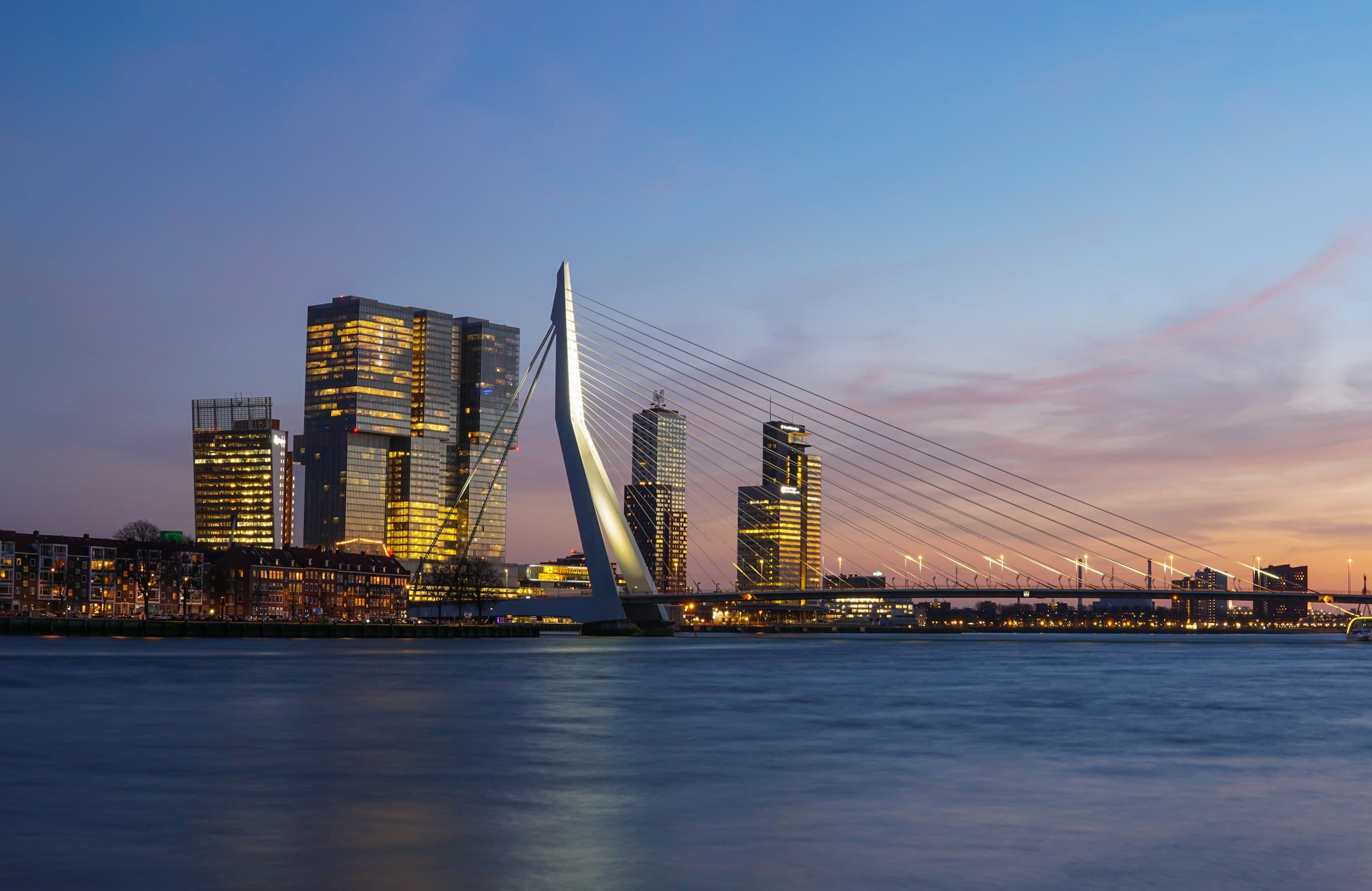Rotterdam at blue hour — illustrative.